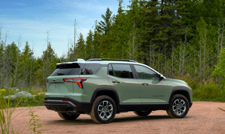 2026 Chevy Equinox parked on a rocky shoreline