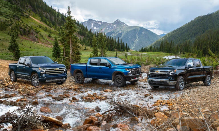 2026 Chevrolet Silverado 1500 trio parked in mountains