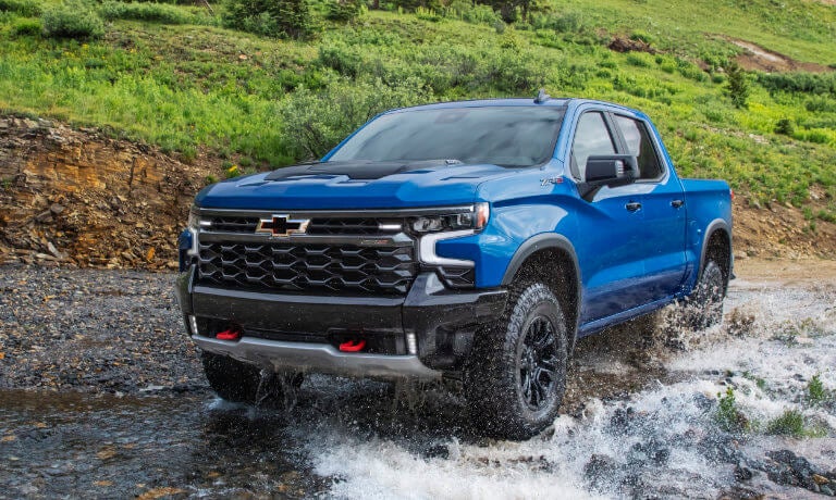 2026 Chevy Silverado 1500 driving in a stream