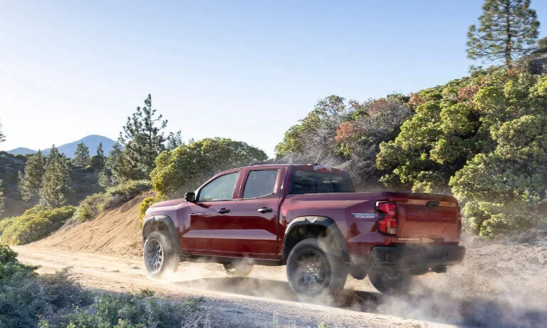 2026 Chevy Colorado kicking up dust on canyon road