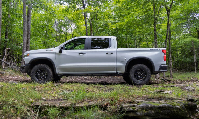 2026 Chevy Silverado 1500 side view in a forest