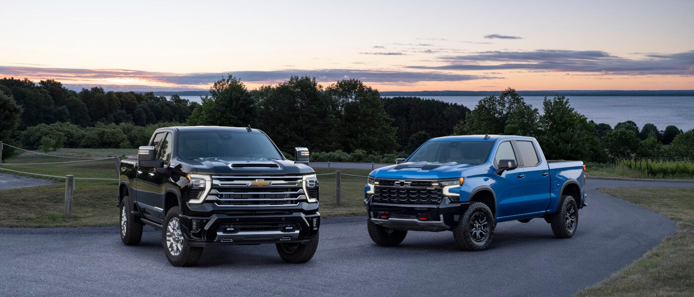 2026 Chevy Silverado 2500 HD pair overlooking lake