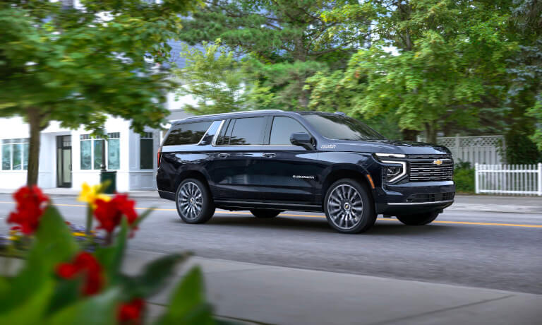 2026 Chevy Suburban driving in a neighborhood