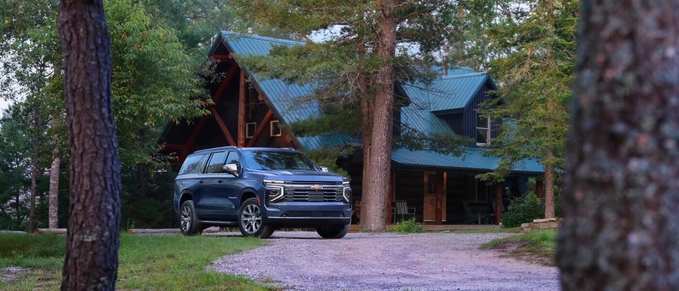 2026 Chevy Suburban parked at a cabin
