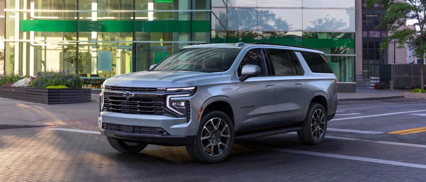 2026 Chevy Suburban parked by an office building