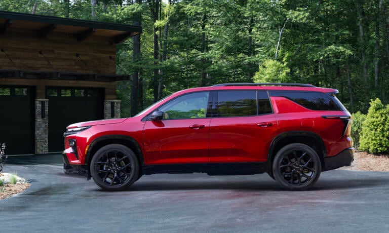 2026 Chevy Traverse side view parked outside cabin