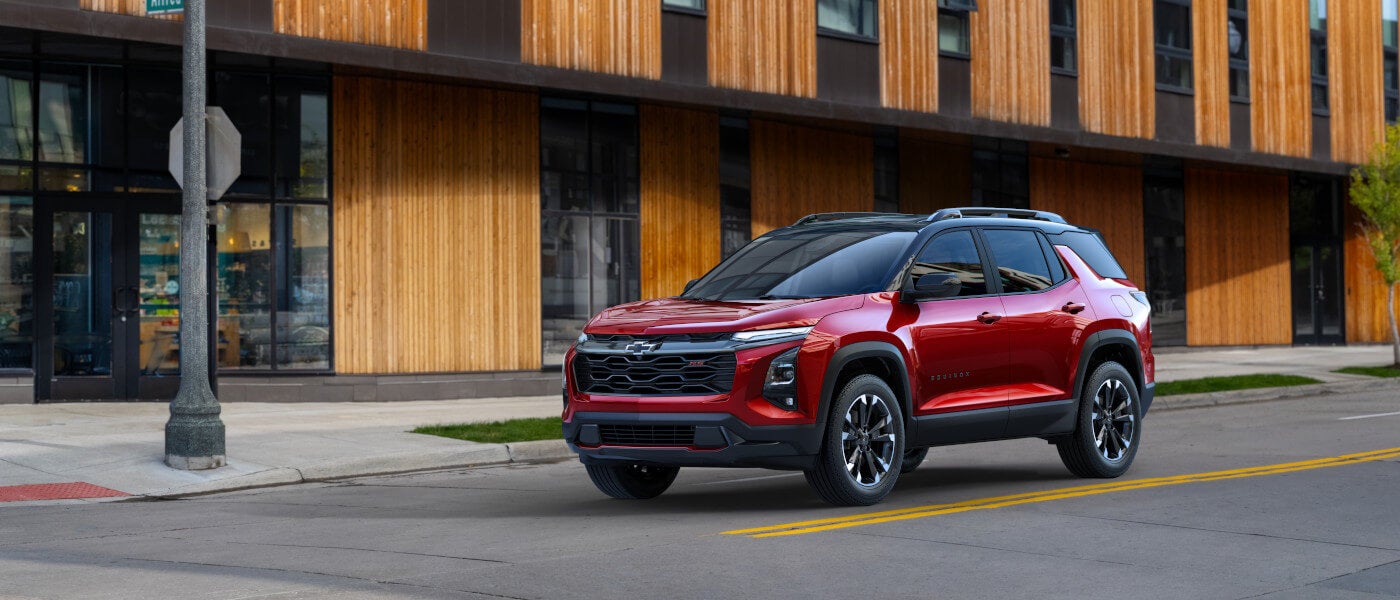 2027 Chevy Equinox waiting at a stoplight in town